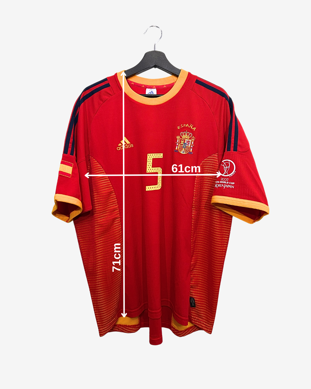 Red sports jersey with measurements on a white background