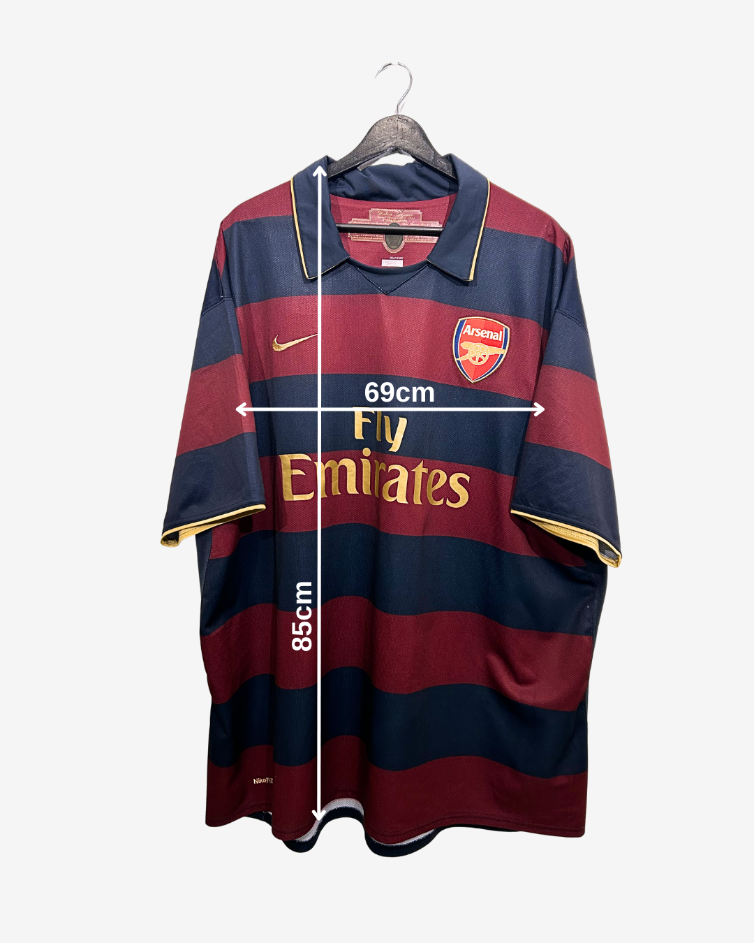 Arsenal football jersey with dimensions on a white background