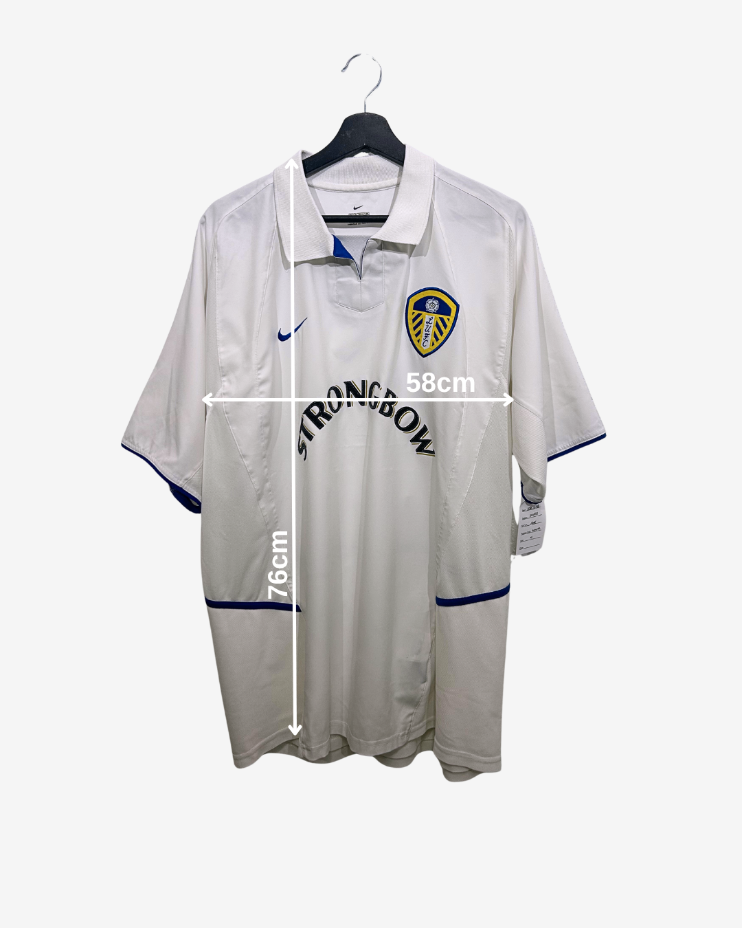 White sports jersey with measurements on a white background