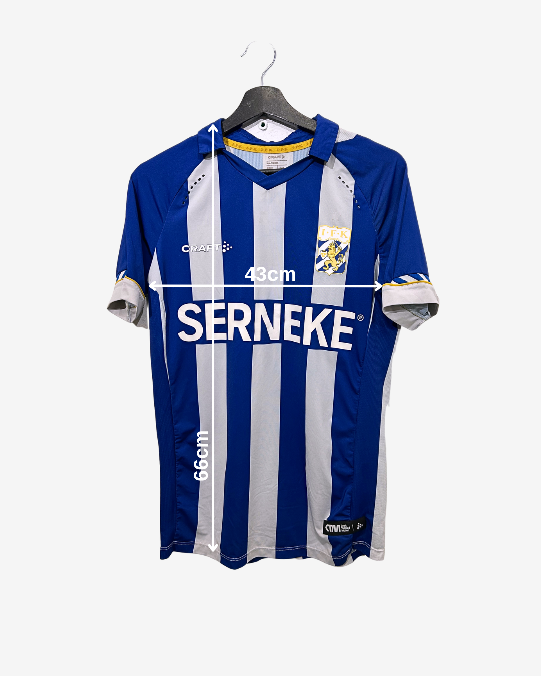 Blue and white sports jersey on a hanger with branding and measurements.