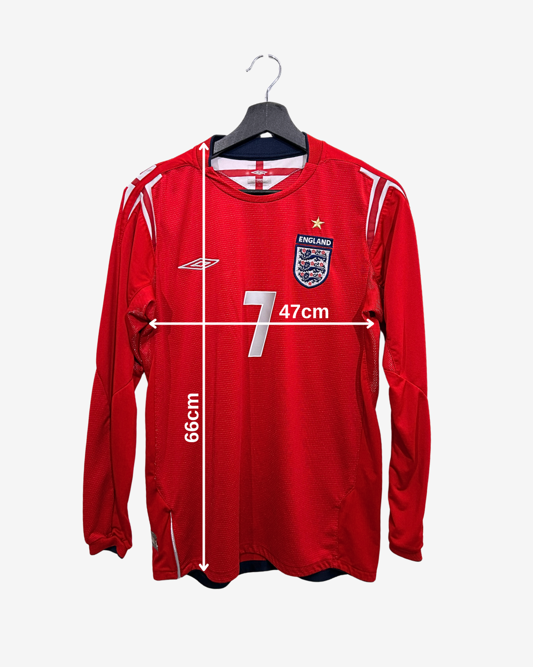 Red sports jersey with measurements on a white background