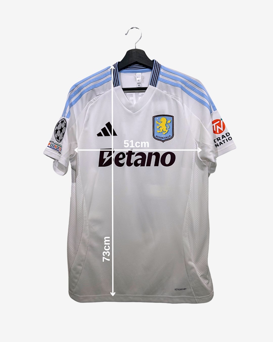 White sports jersey with branding and measurements on a white background