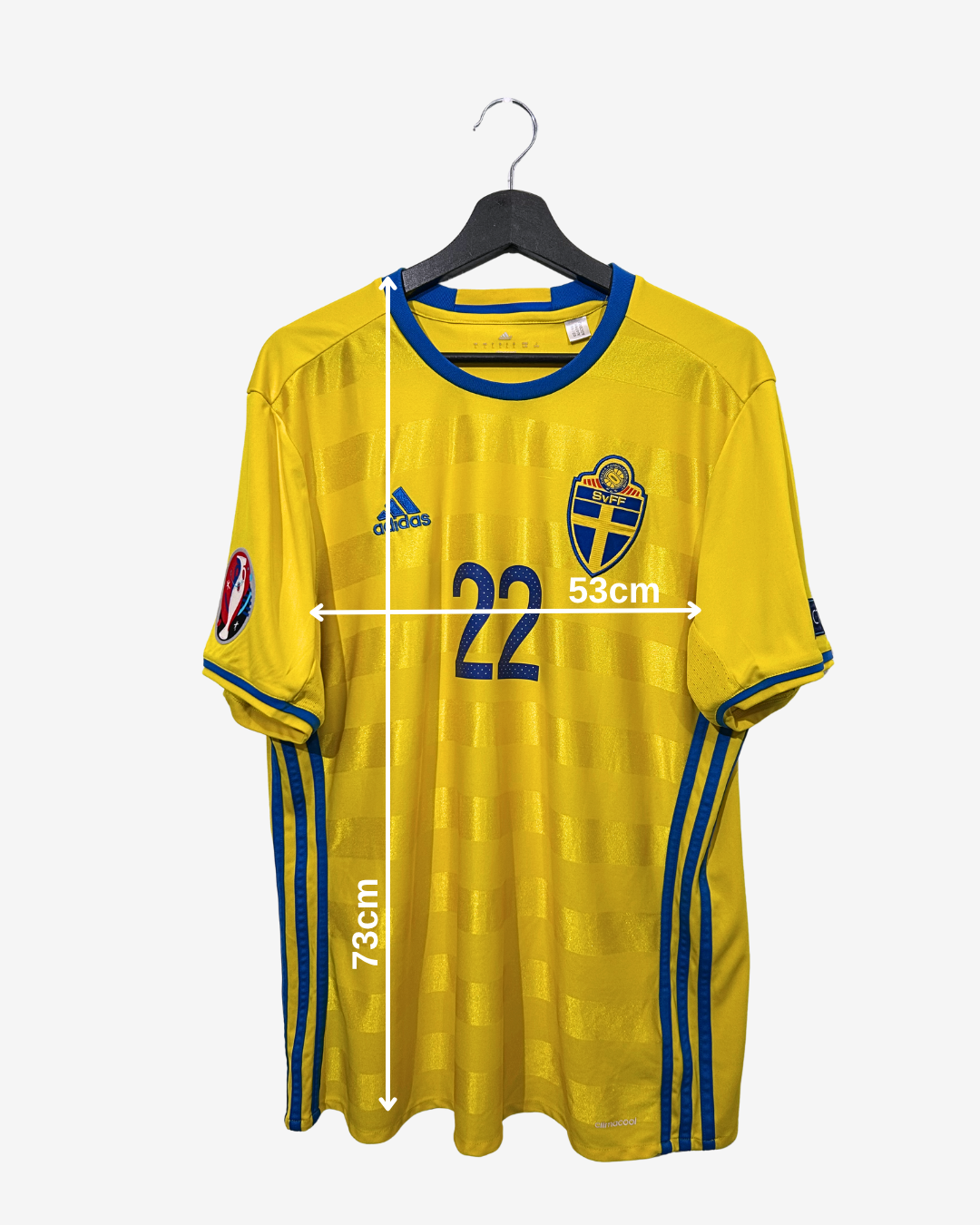 Yellow sports jersey with blue accents on a hanger, featuring Adidas logo and measurements.