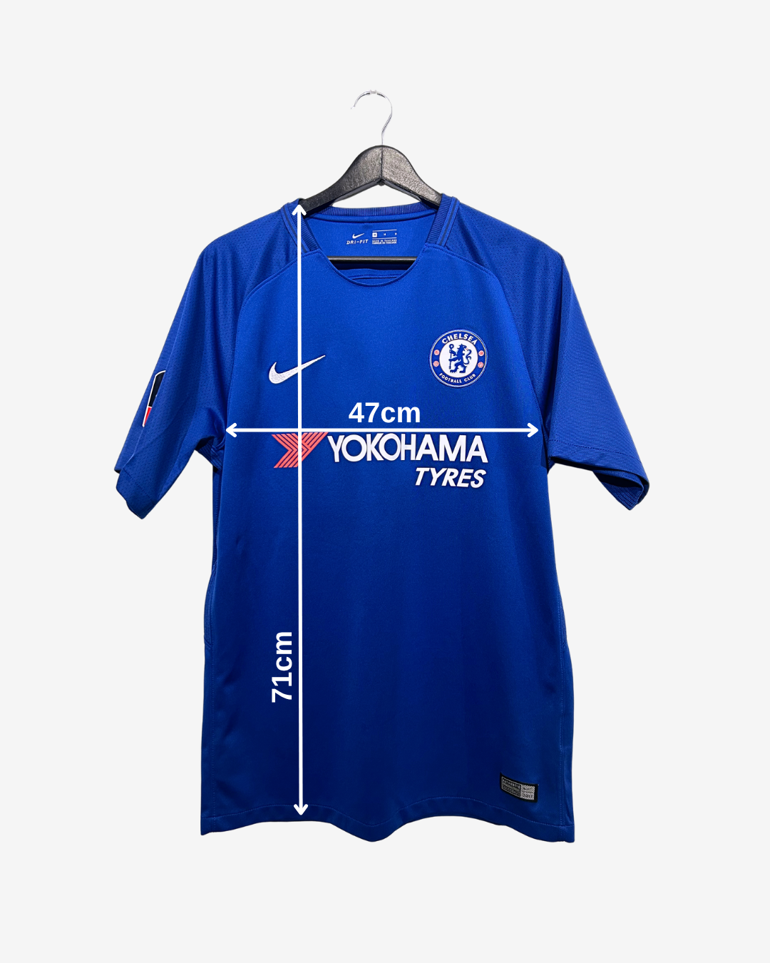 Blue sports jersey with branding on a hanger against a white background