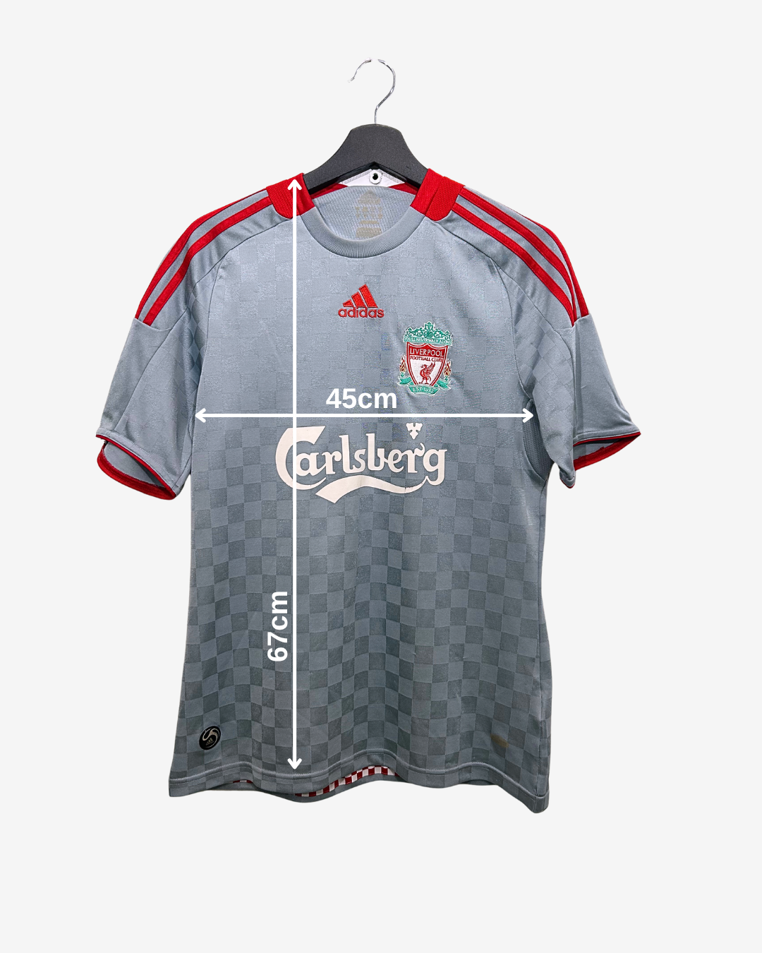 Gray sports jersey with red accents on a hanger, featuring Adidas and Carlsberg logos, with measurements indicated.