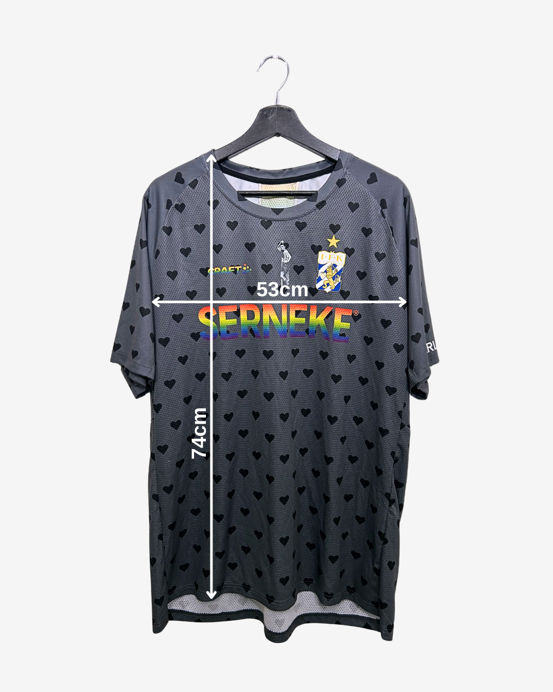 Gray t-shirt with heart patterns and measurements on a white background
