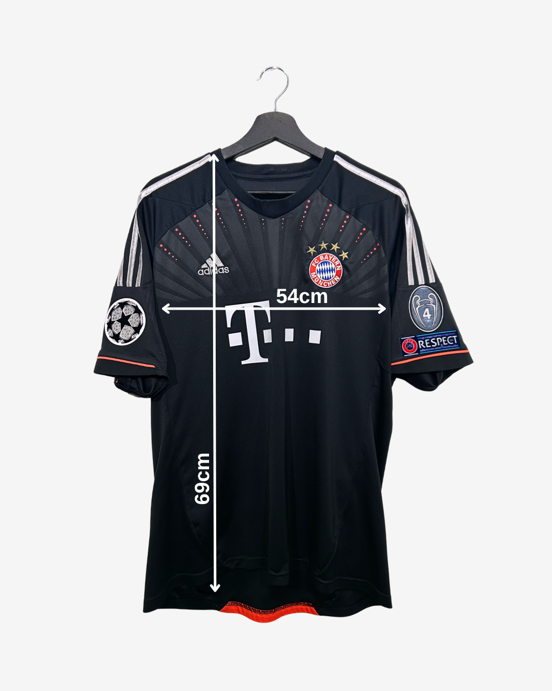 Black sports jersey with branding on a hanger against a white background