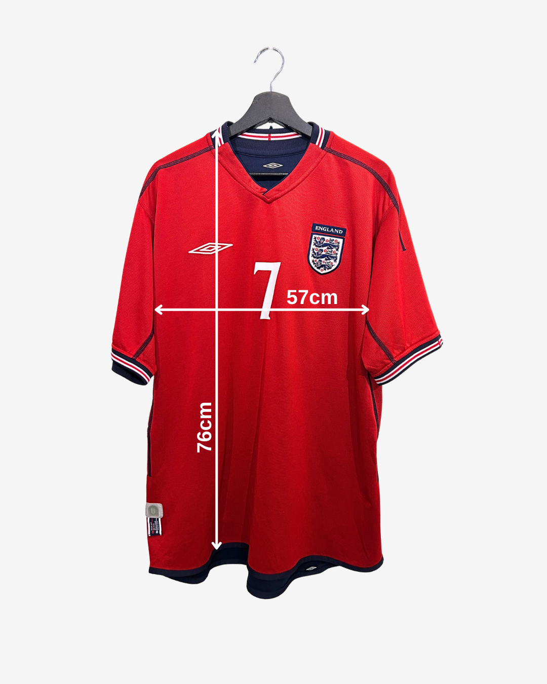 Red sports jersey with measurements on a white background