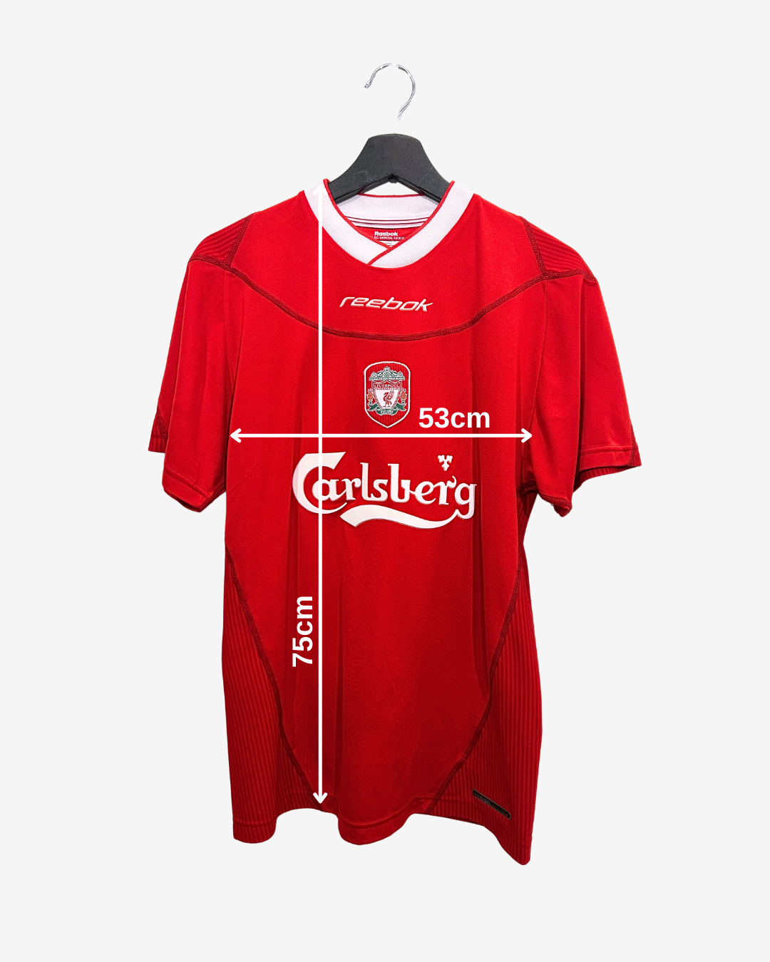 Red sports jersey with visible branding on a white background