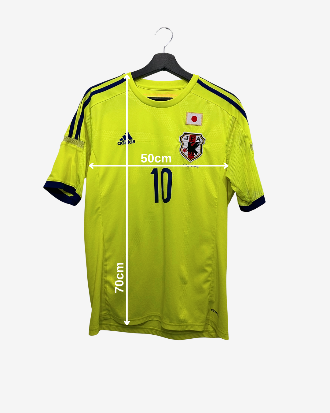 Yellow sports jersey with measurements on a white background