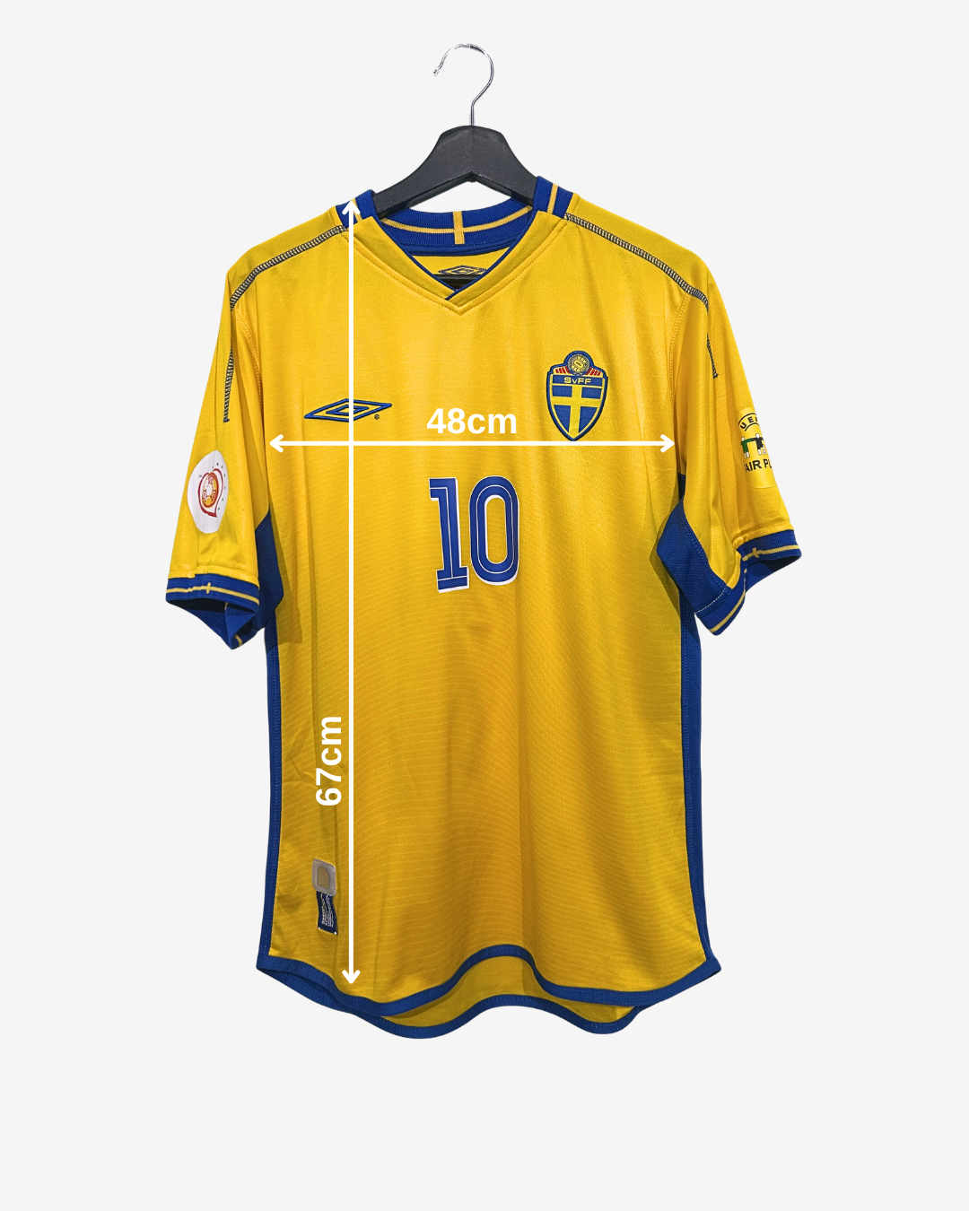 Yellow sports jersey with blue accents on a hanger, showing measurements.
