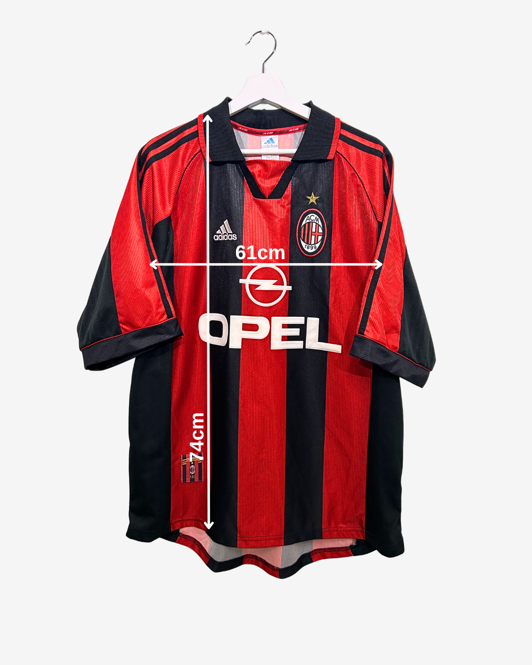 Red and black sports jersey with brand logos on a white background