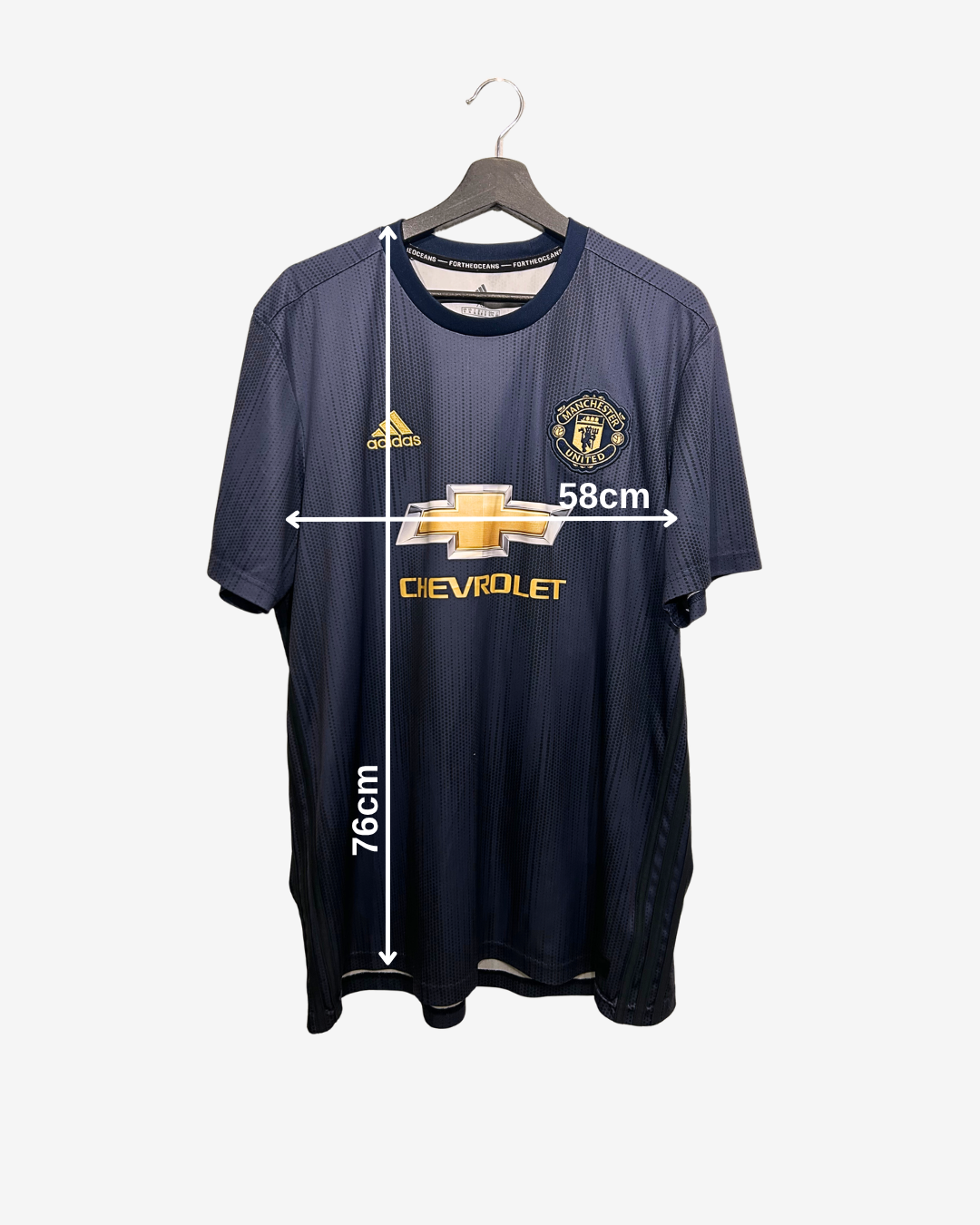 Navy blue sports jersey with measurements on a white background