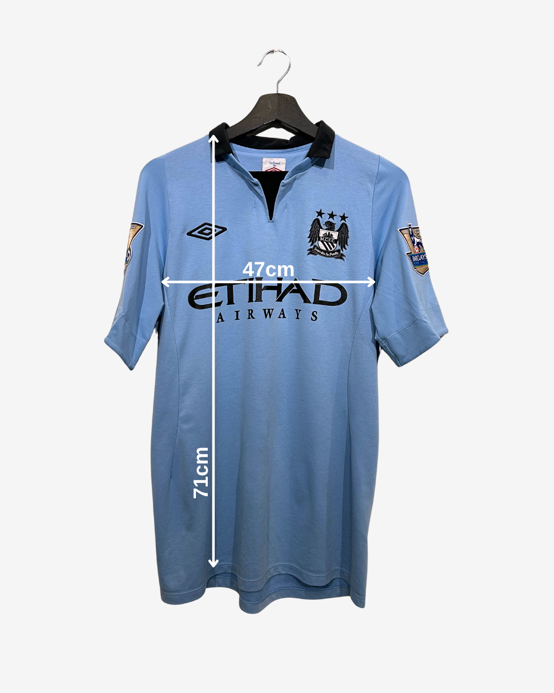 Blue sports jersey with measurements on a white background