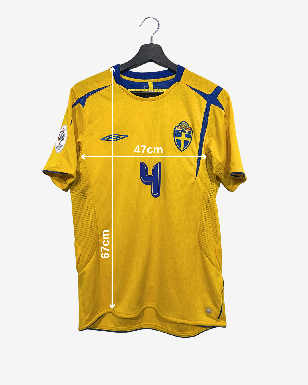Yellow sports jersey with measurements on a white background