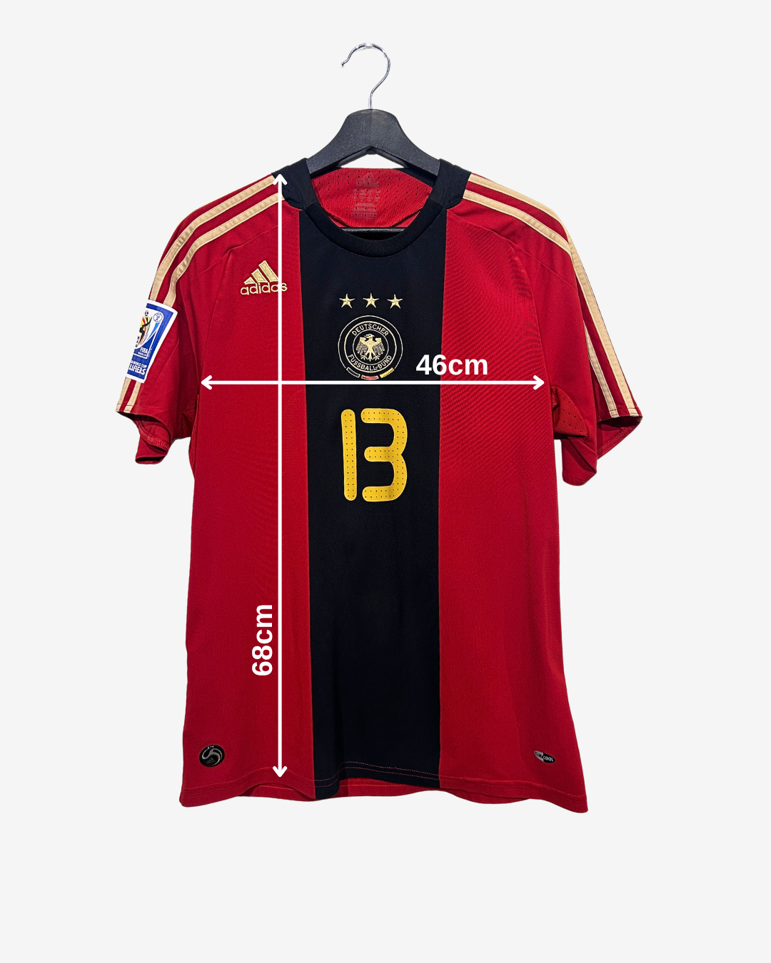 Red and black sports jersey with number 13 and Adidas logo, displayed on a hanger with measurements.