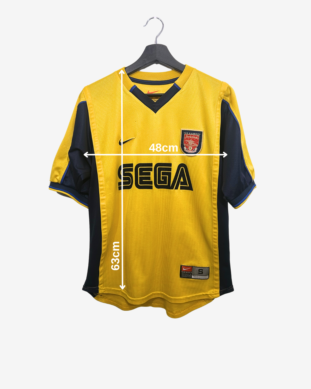 Yellow and black sports jersey with Sega logo on a hanger, showing measurements.