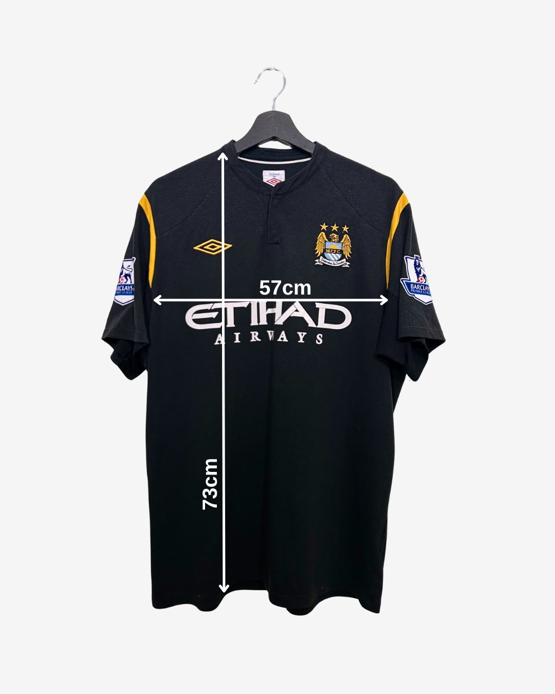 Black sports jersey with branding on a white background