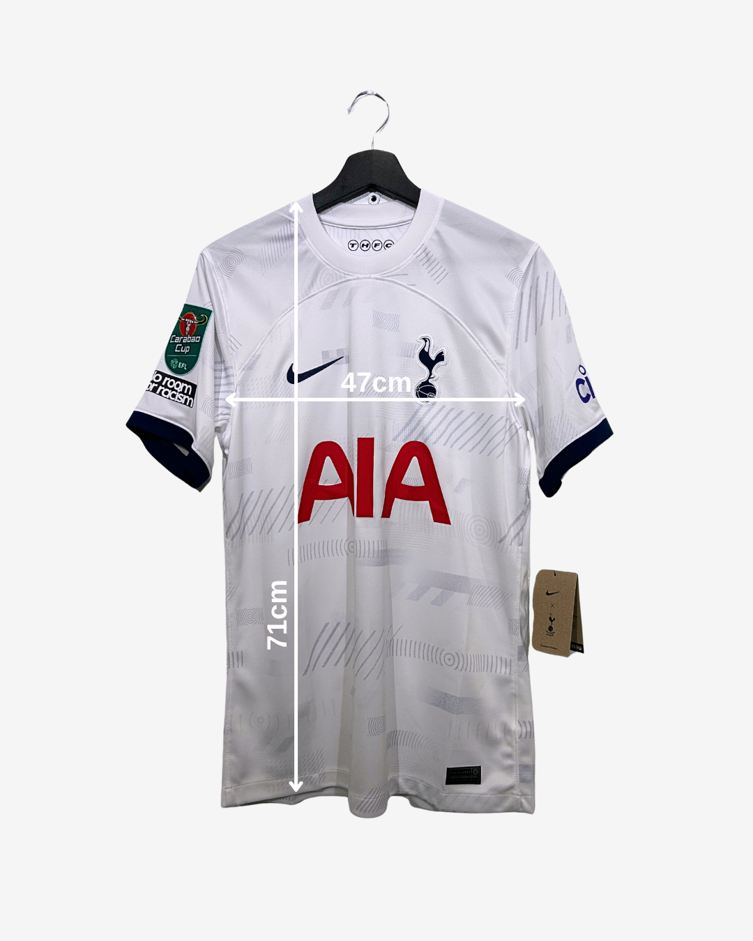 White sports jersey with branding and measurements on a white background