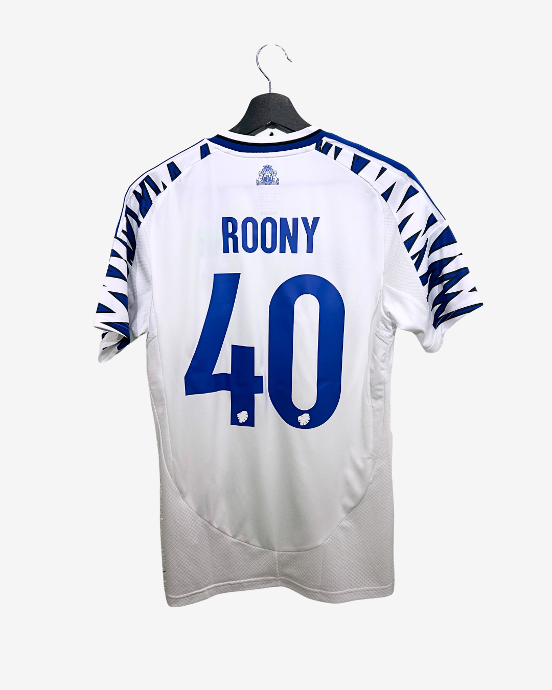 White sports jersey with blue numbering and text on a hanger against a white background