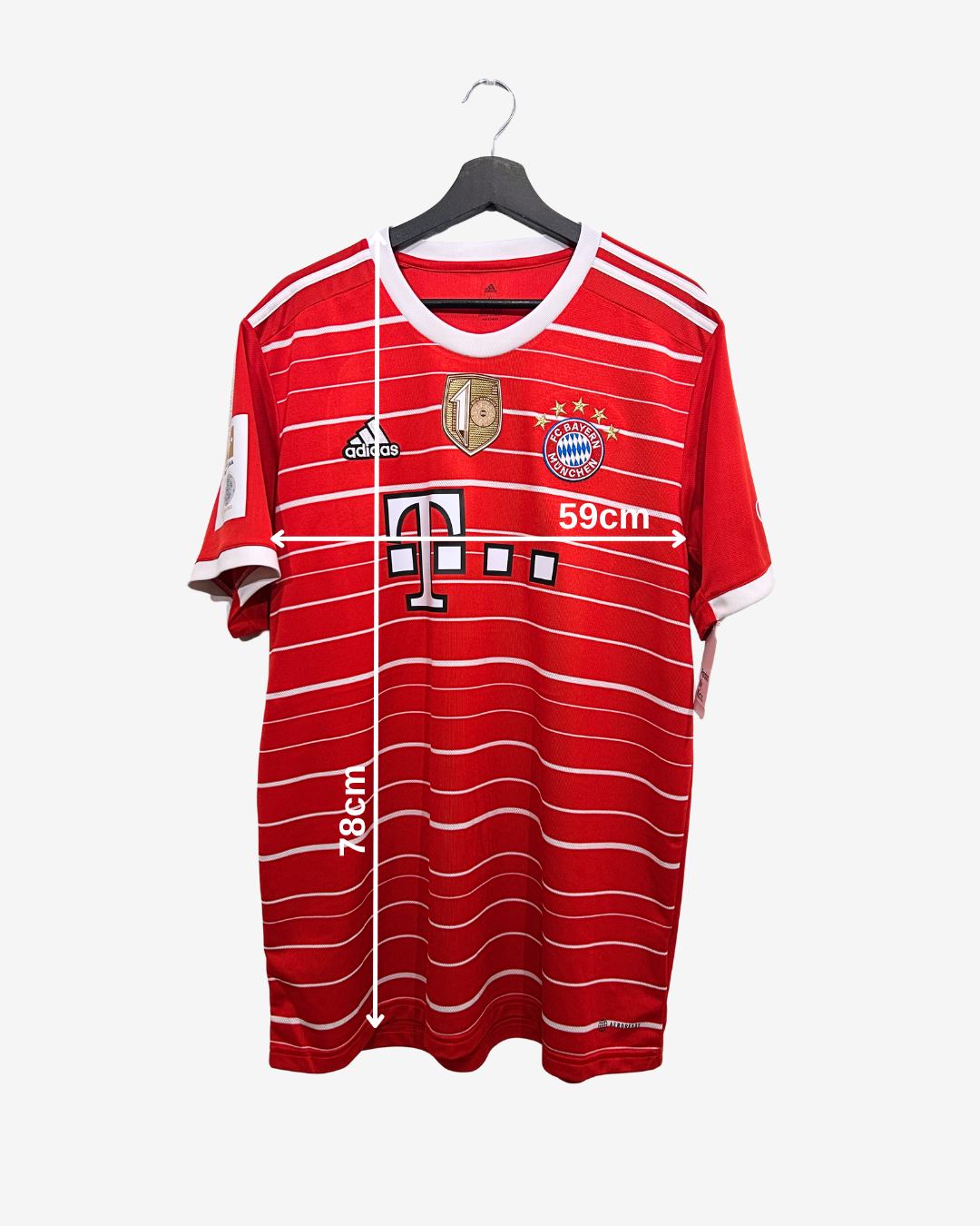 Red sports jersey with white stripes on a hanger against a white background