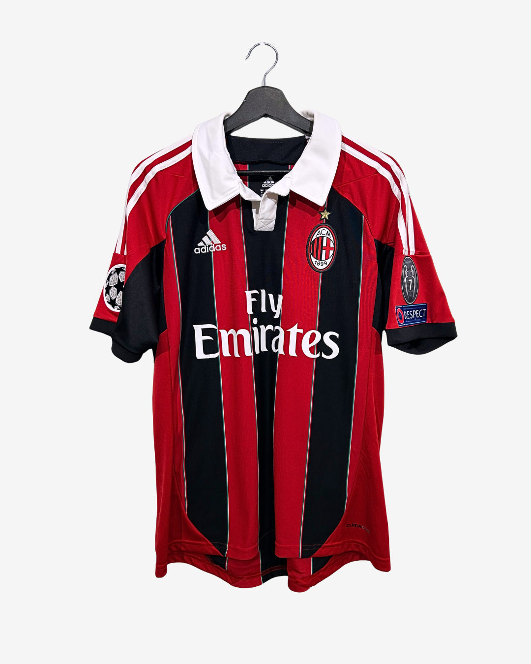 Red and black sports jersey with Adidas logo on a white background