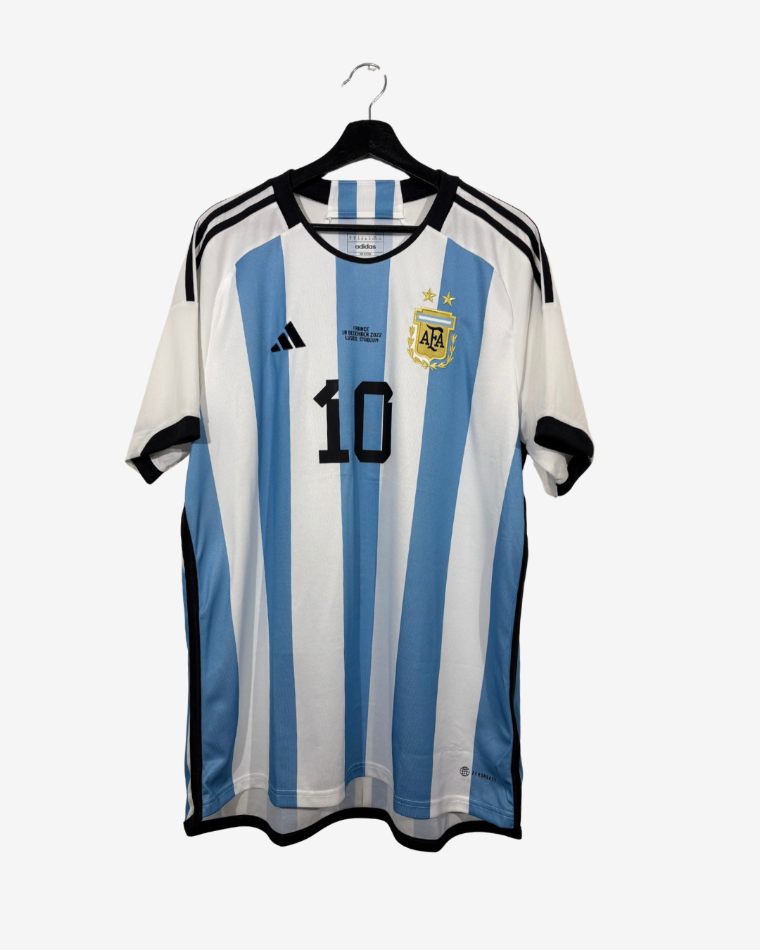 An Argentina national football team home jersey by Adidas, featuring light blue and white vertical stripes, the number 10 on the front, and the AFA crest, hanging on a black hanger against a light gray background.