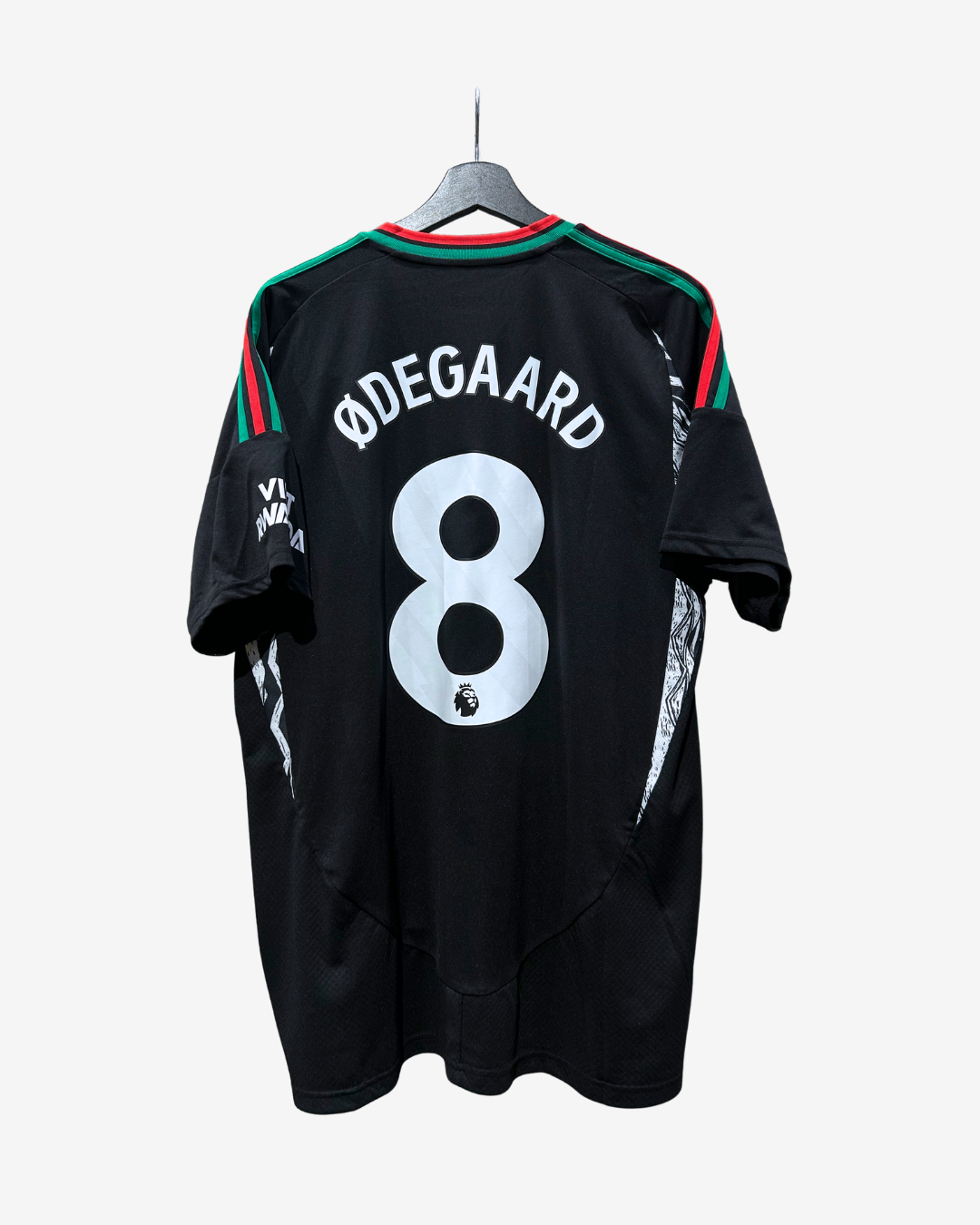 Black Denmark national football team jersey with 'ØDEGAARD' and number '8' printed on the back, hanging on a gray hanger against a light gray background.