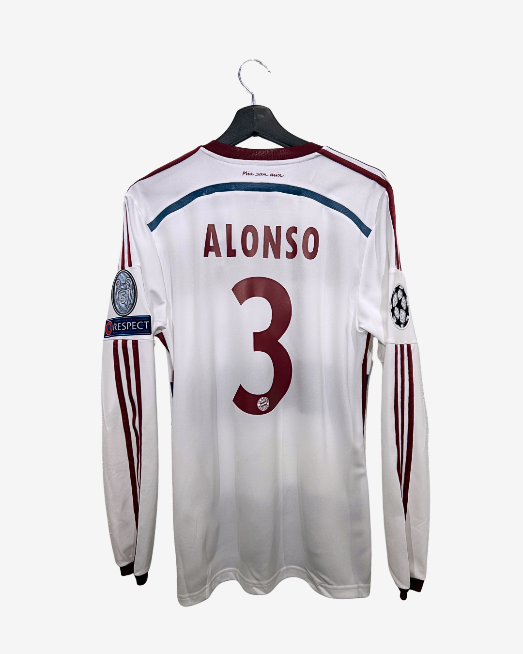 White sports jersey with red and blue accents, featuring the name 'Alonso' and number '3', on a hanger against a white background.
