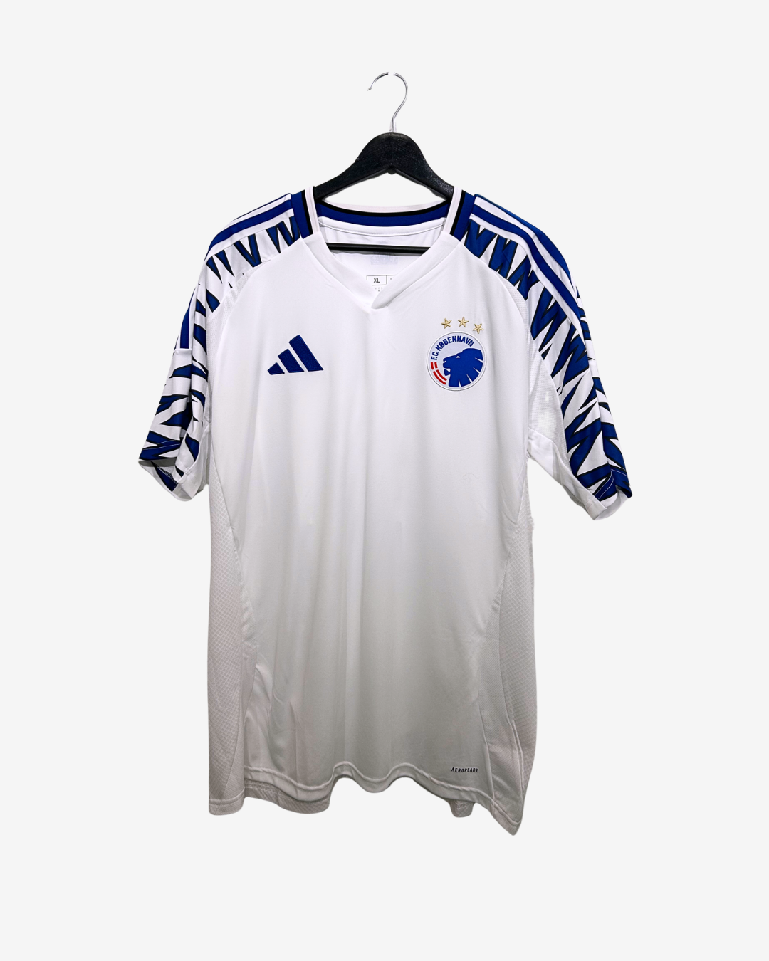 White sports jersey with blue accents on a hanger against a white background