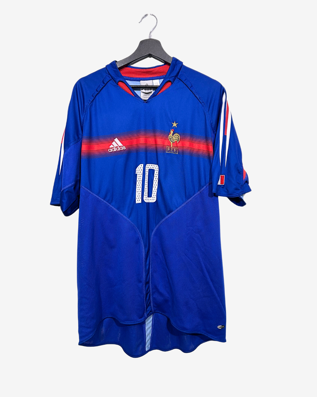 Blue soccer jersey with number 10 on a hanger against a white background