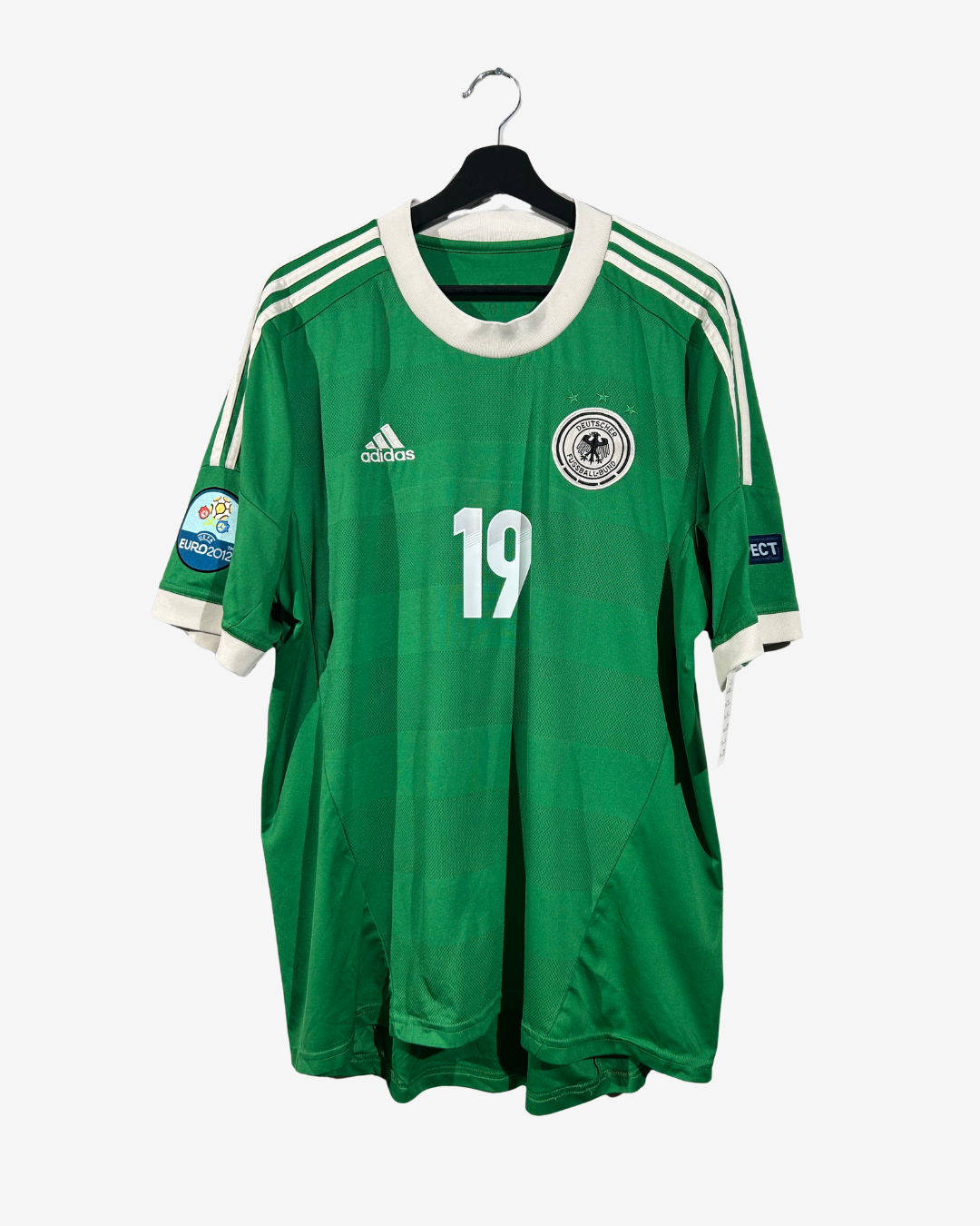 Green sports jersey with number 19 on a hanger against a white background