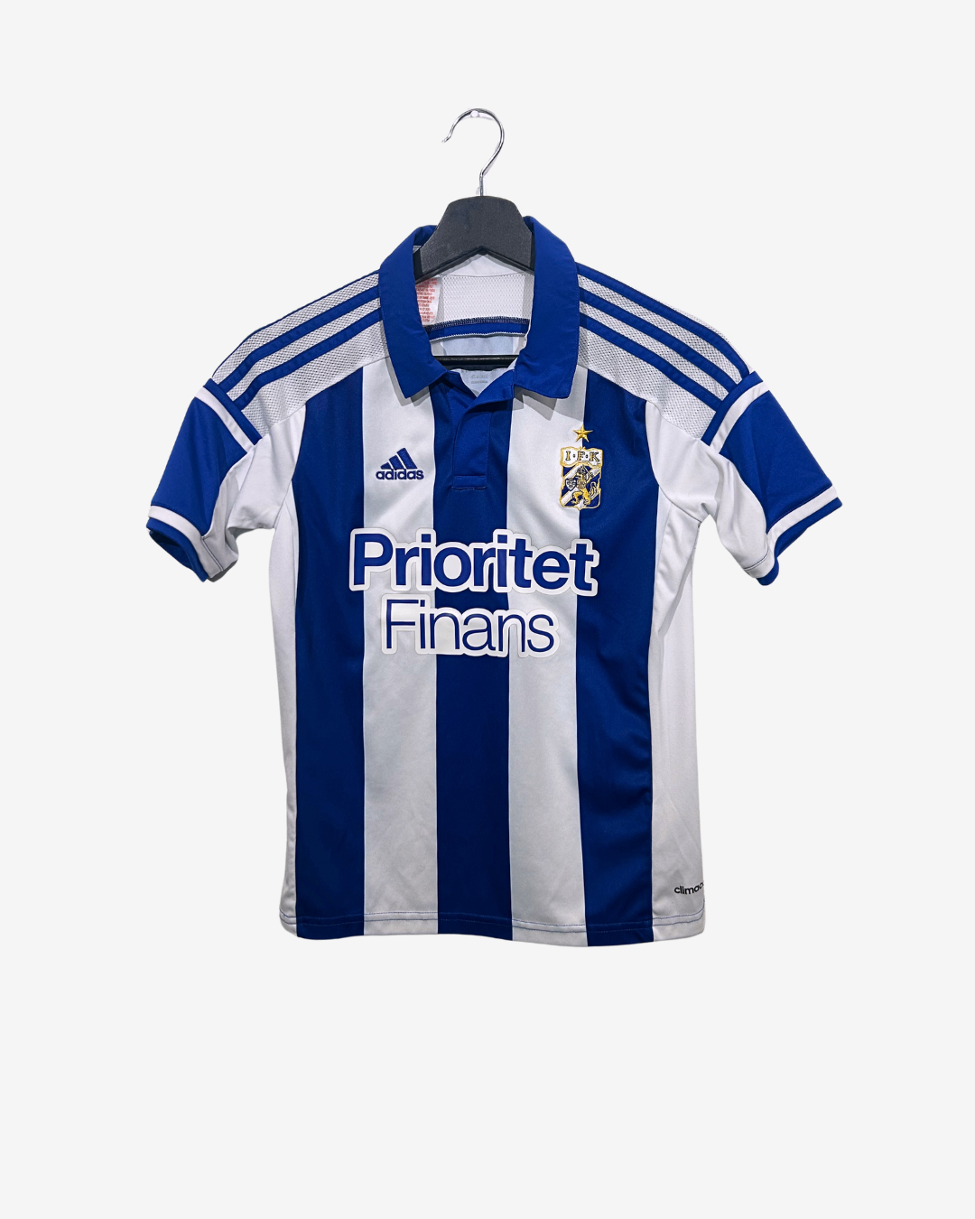 Blue and white striped sports jersey with Adidas logo on a hanger