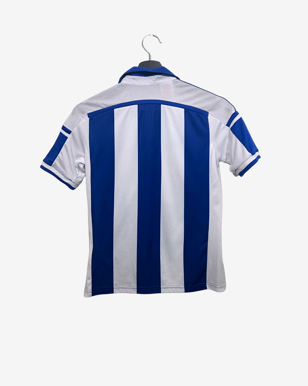 Blue and white striped shirt on a hanger against a white background