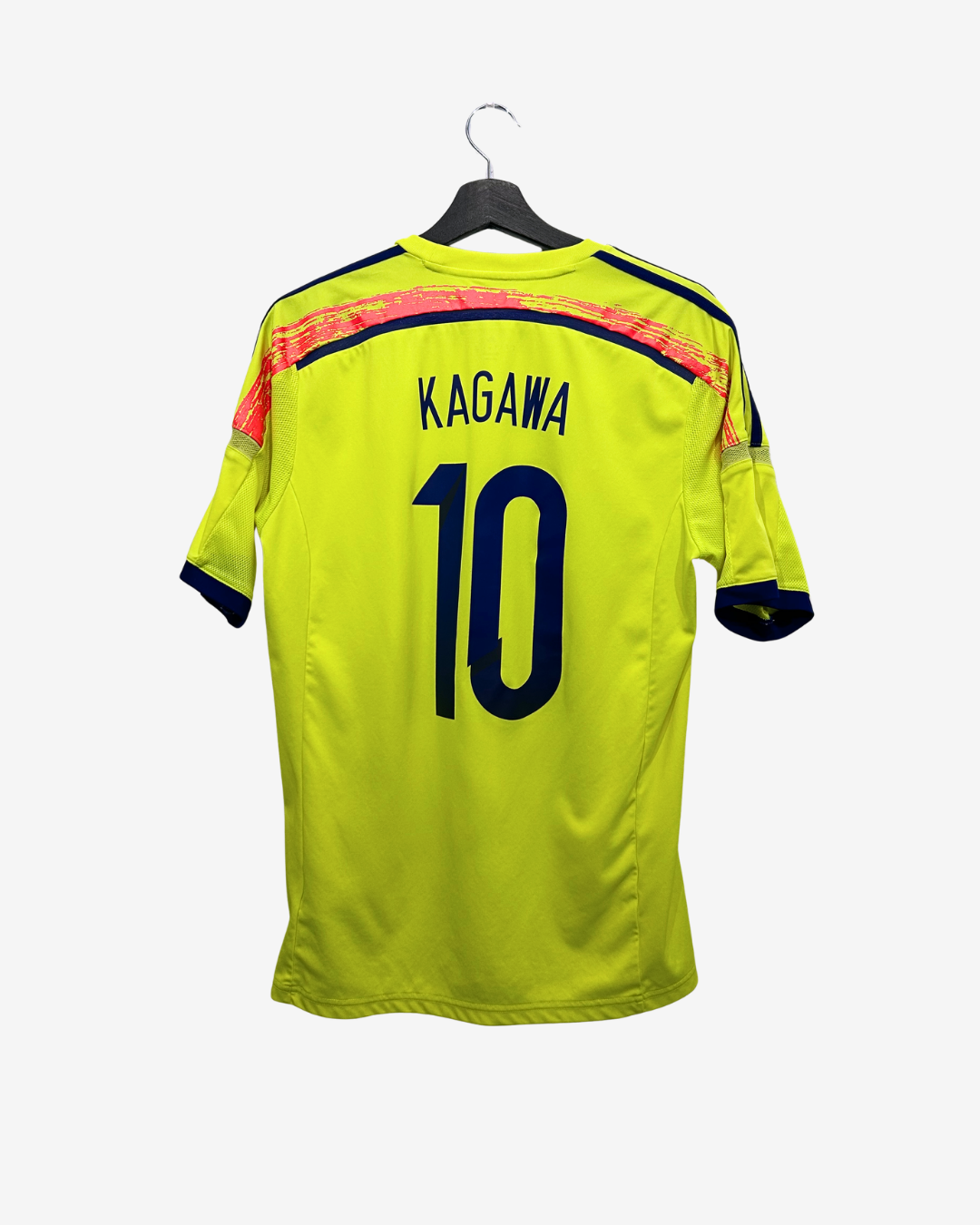 Yellow sports jersey with 'Kagawa' and number '10' on a hanger against a white background