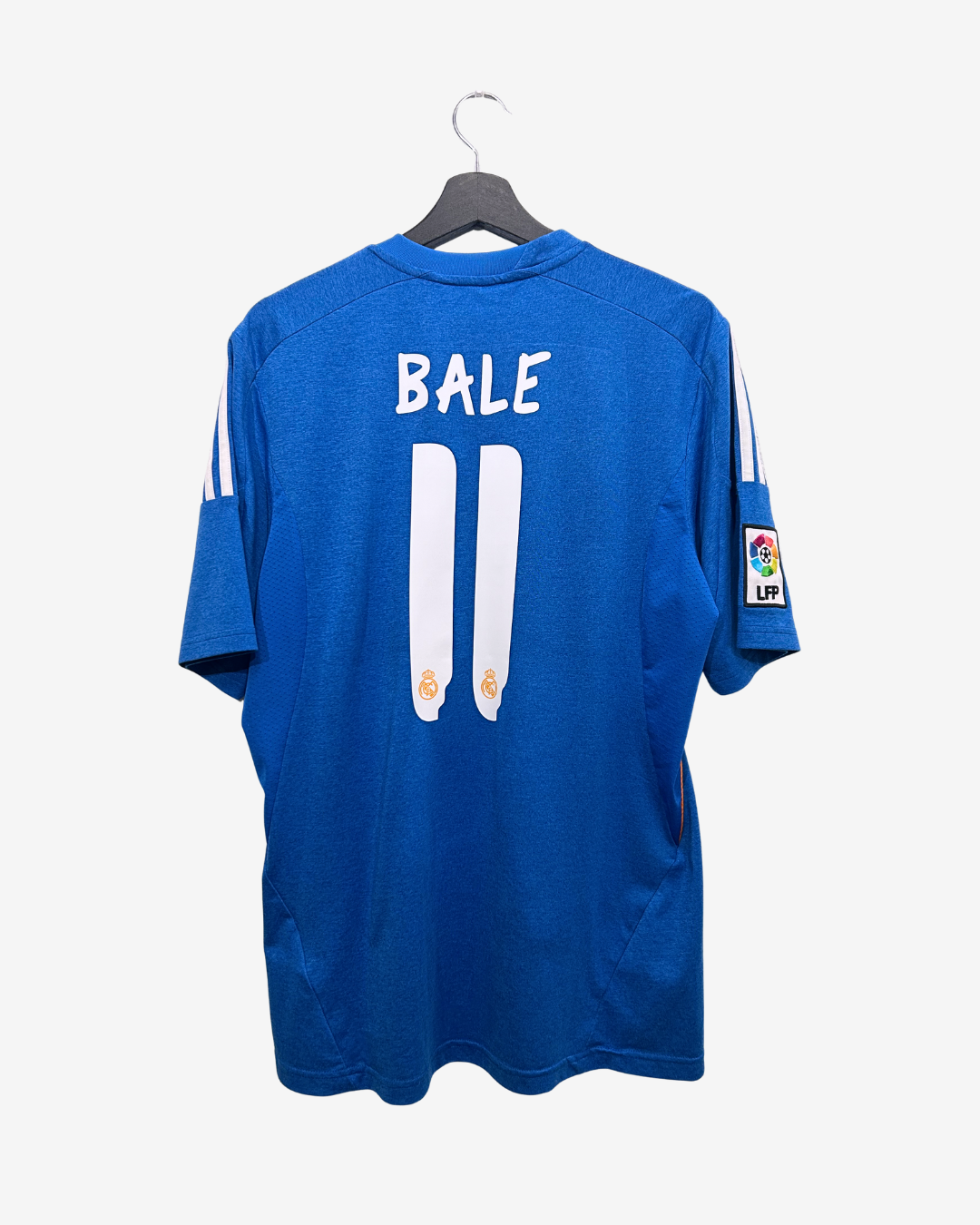Blue sports jersey with 'BALE' and number '11' on a hanger against a white background