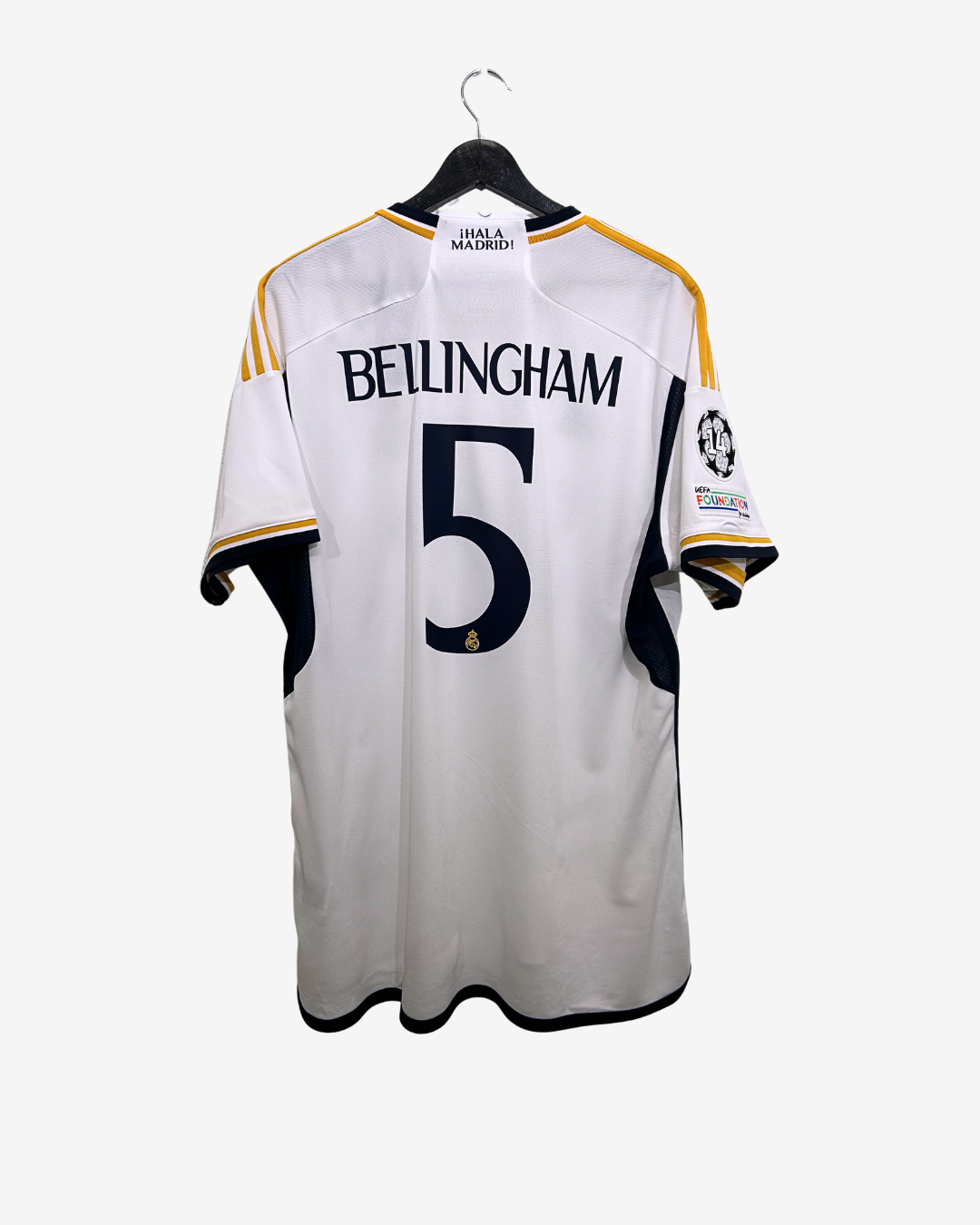 White sports jersey with 'Bellingham' and number '5' on a hanger against a white background