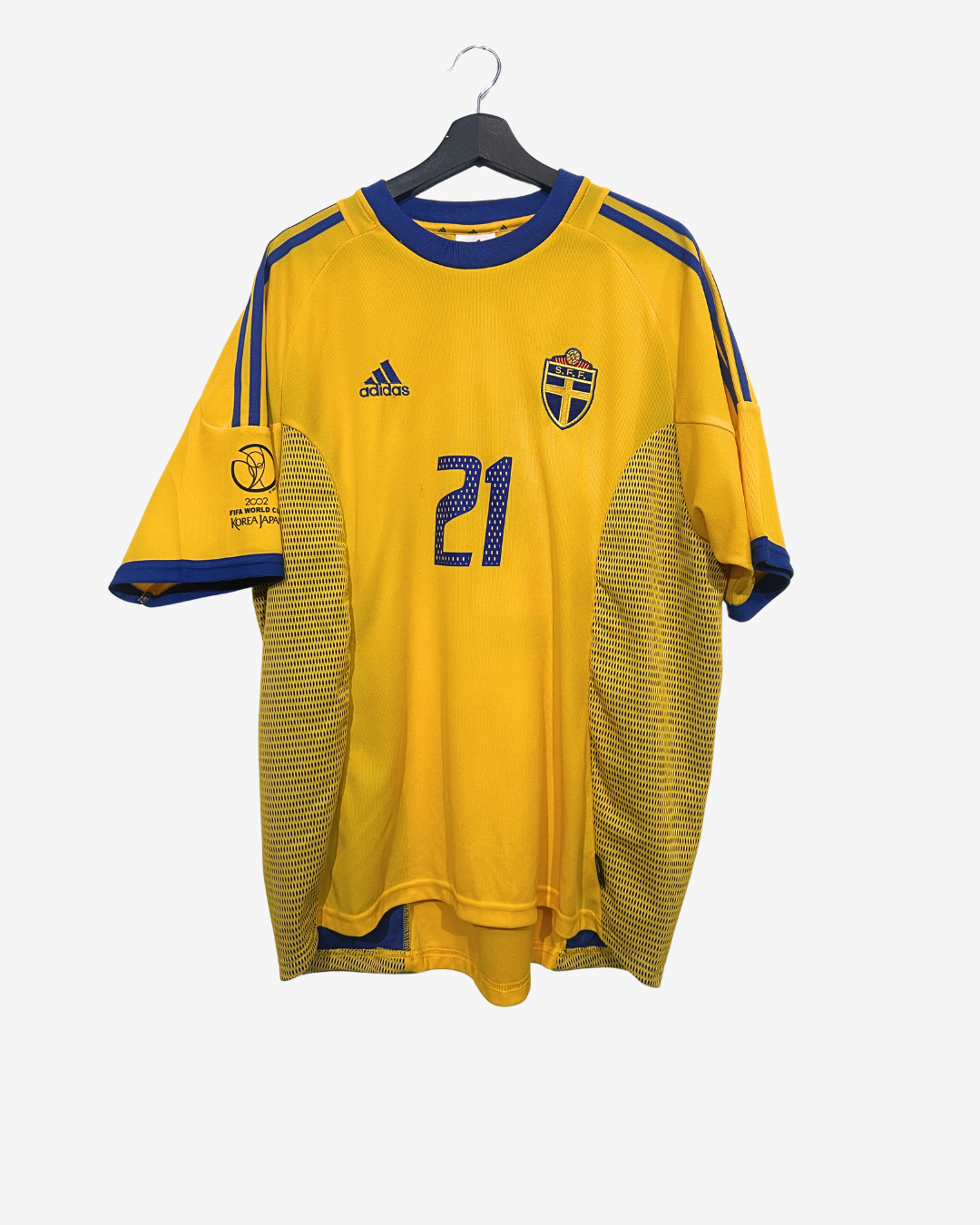 Yellow soccer jersey with blue accents on a hanger against a white background