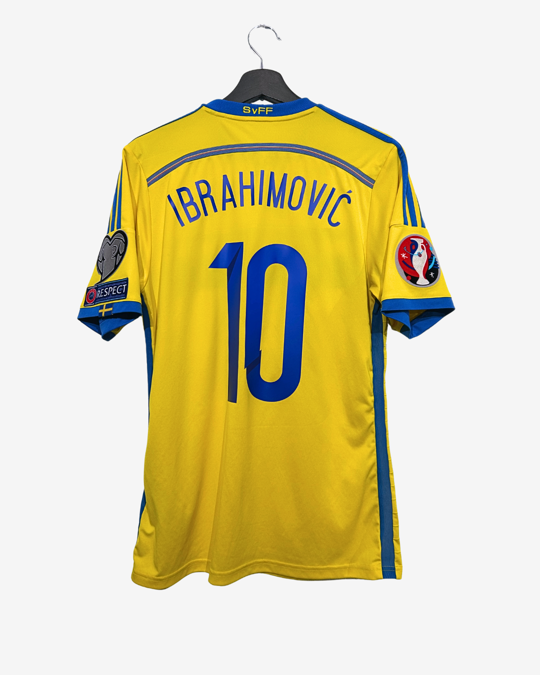 Yellow sports jersey with 'Ibrahimovic' and number '10' on a hanger against a white background