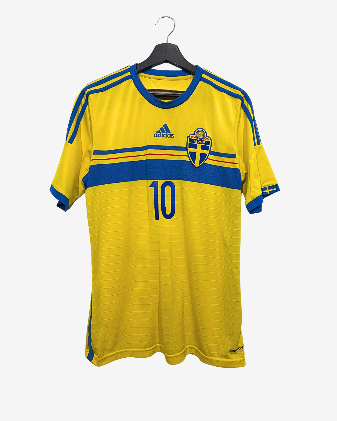 Yellow sports jersey with blue accents and a logo on a hanger against a white background