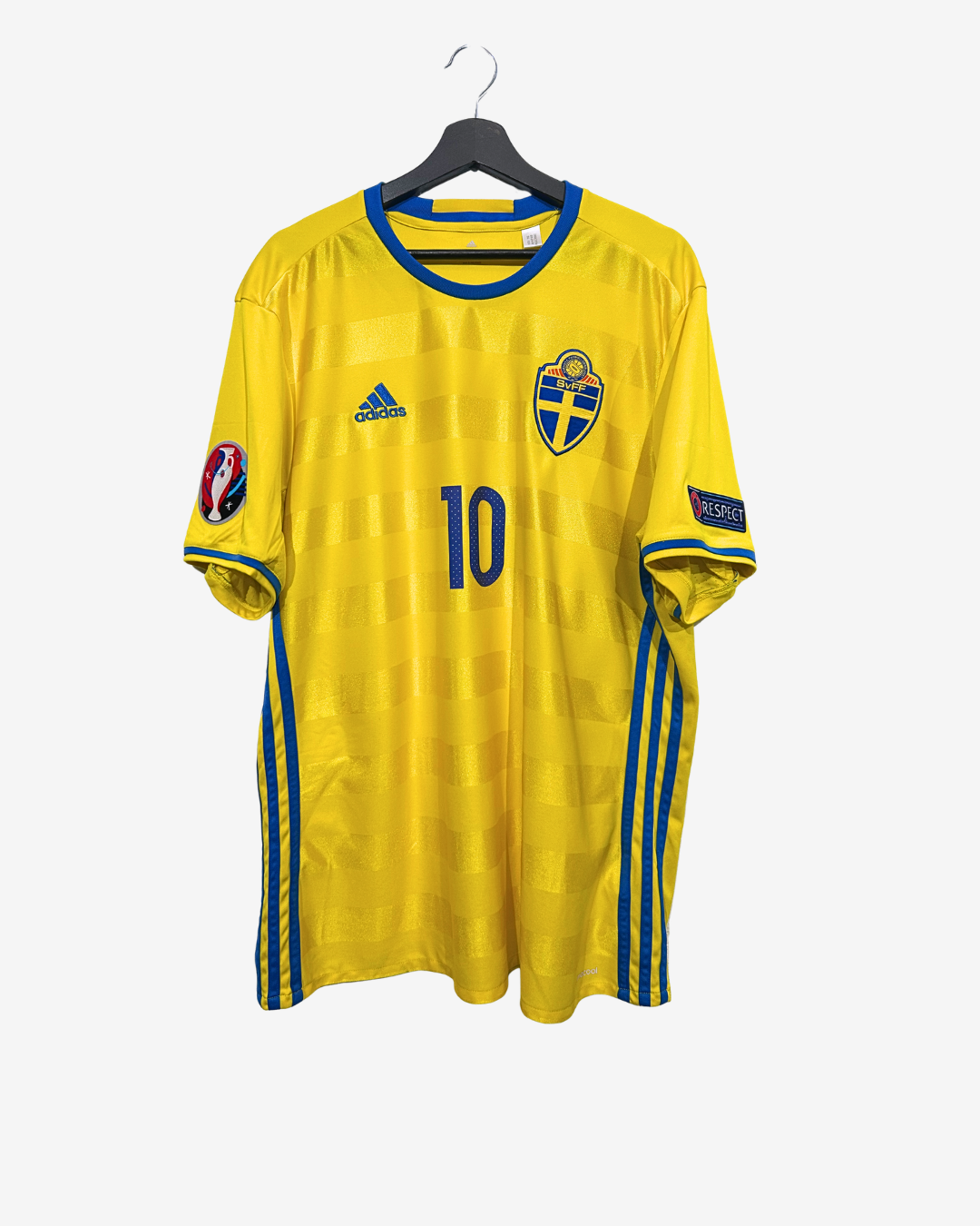Yellow sports jersey with blue accents on a hanger against a white background