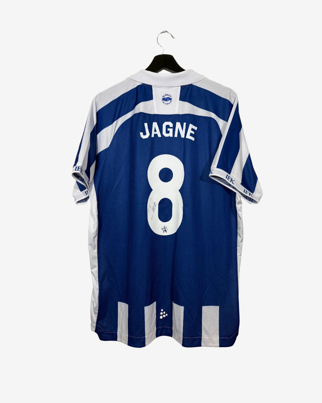 A blue and white striped soccer jersey with 'JAGNE' and the number '8' printed on the back, hanging on a black hanger against a light gray background.