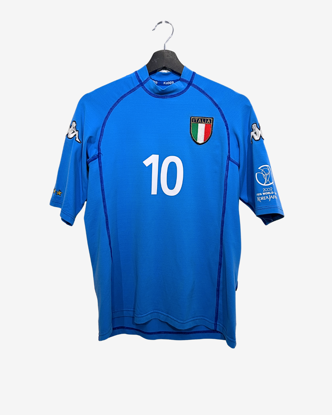 Blue sports jersey with number 10 and Italian flag emblem on a hanger