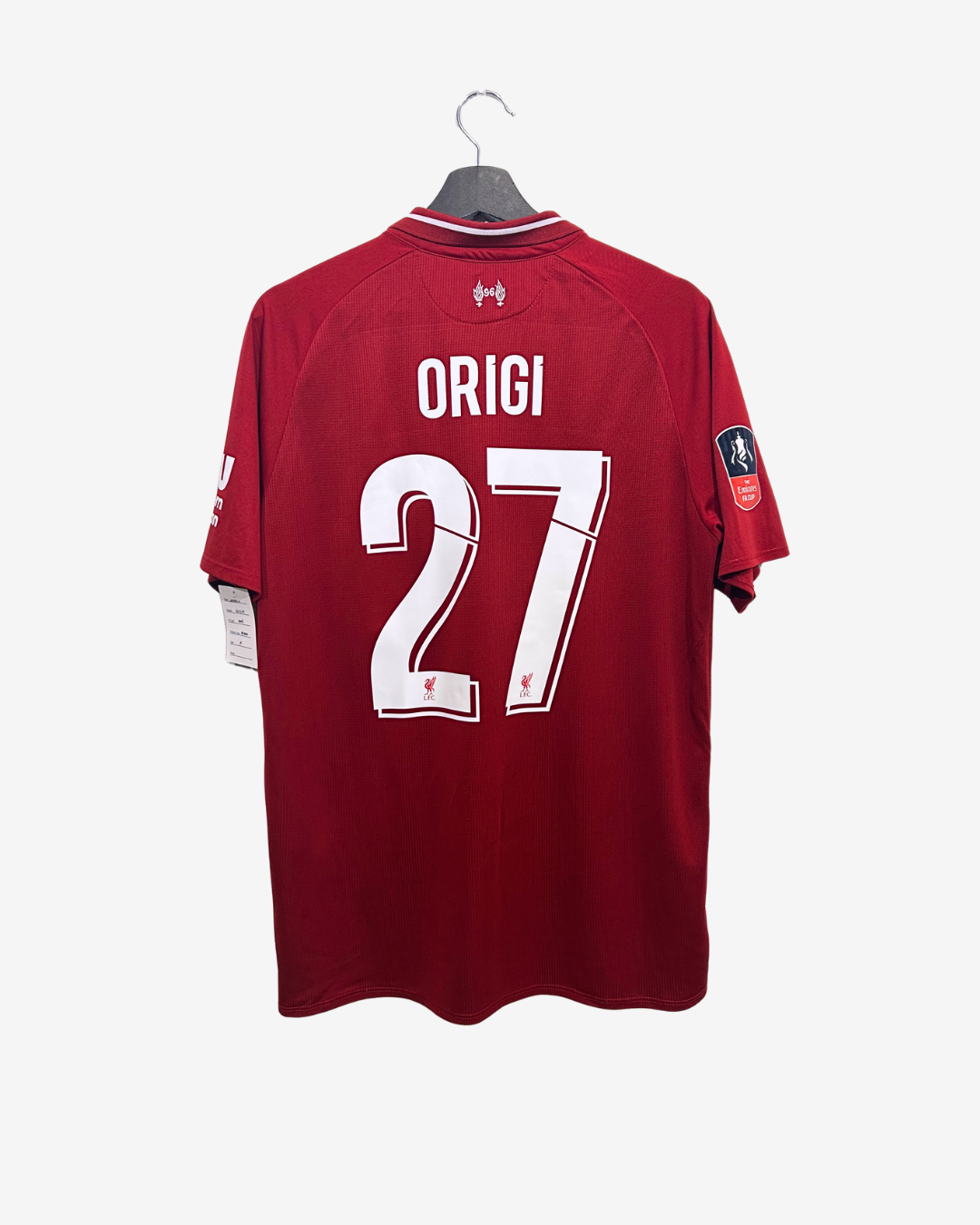 Red sports jersey with 'ORIGI' and number '27' on a hanger against a white background