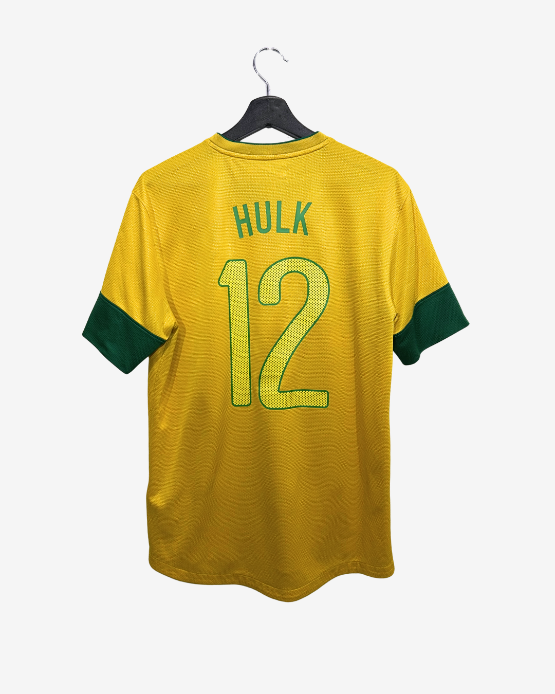 Yellow sports jersey with number 12 and name 'Hulk' on a hanger against a white background