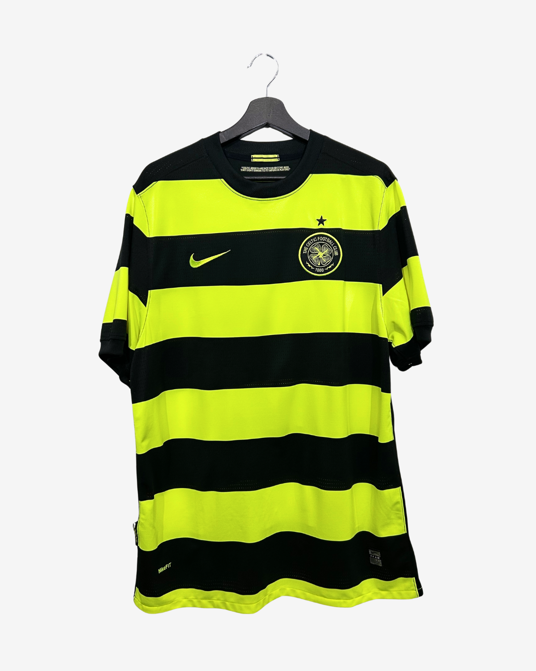 Black and yellow striped shirt on a hanger with Nike logo.