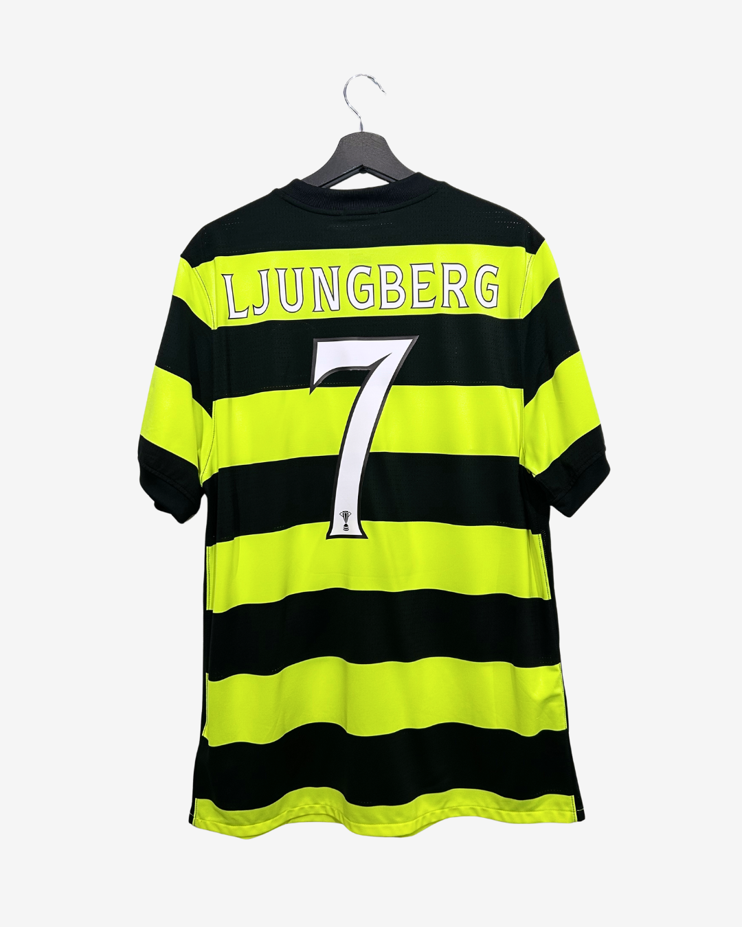 Black and yellow striped sports jersey with 'LJUNGBERG' and number '7' on a hanger.