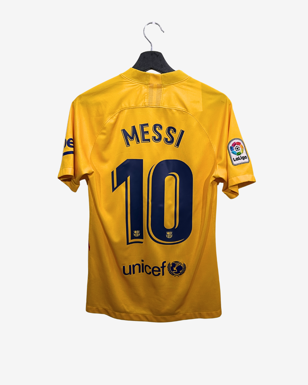 Yellow sports jersey with 'Messi' and number '10' on a hanger against a white background