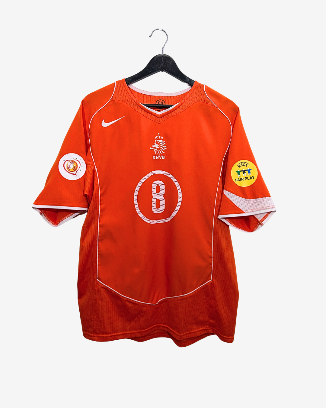 Orange sports jersey with number 8 on a hanger against a white background