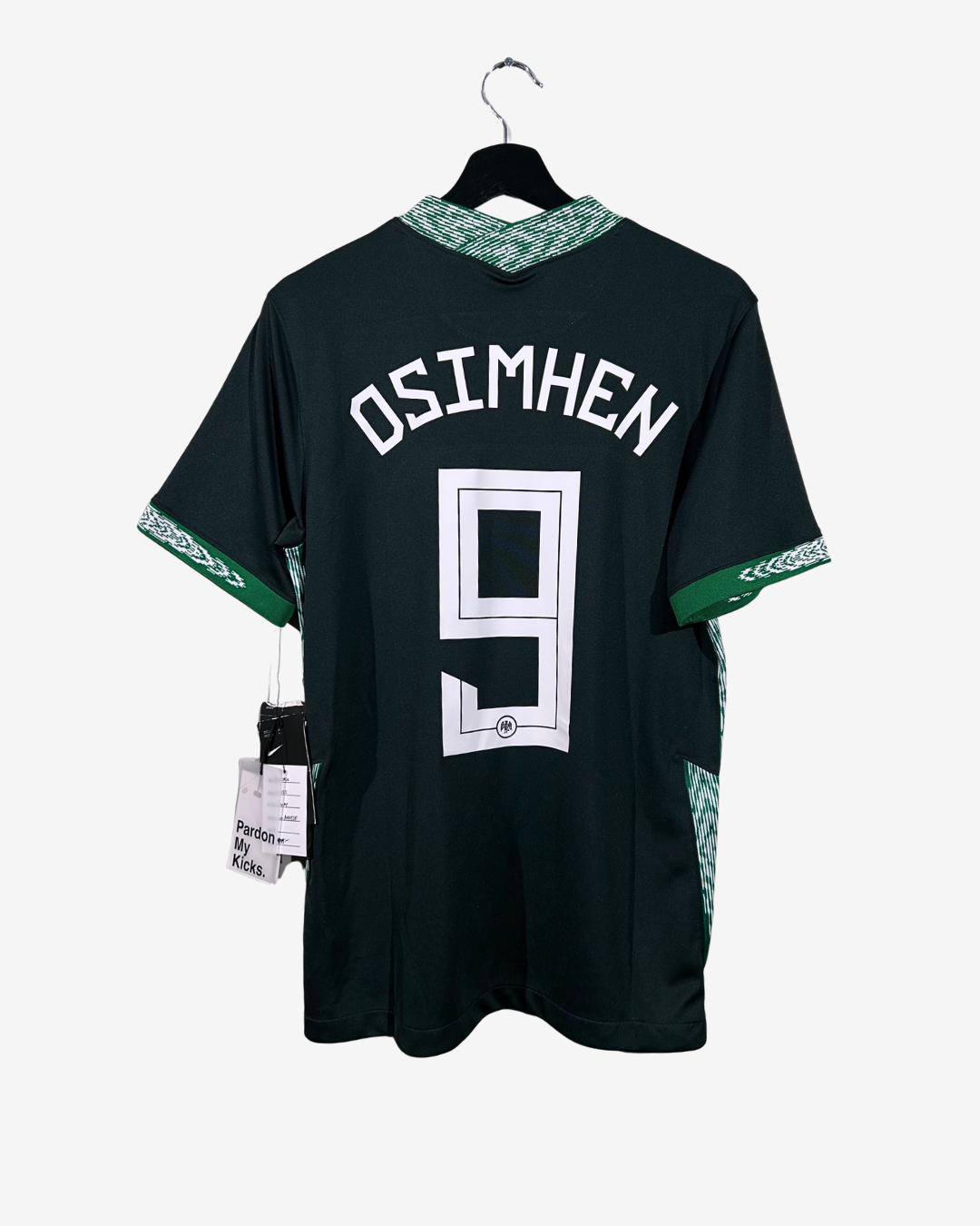 Black sports jersey with 'Osimhen' and number '9' on a hanger against a white background